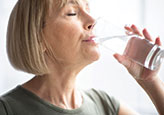 Senior-Woman-Drinking-Water-from-a-Glass-THMB